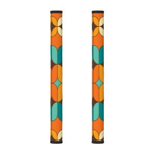 May include: Two retro-style, patterned objects with a repeating design of orange, teal, and brown shapes. The objects are vertical and have a black top and bottom. The design is reminiscent of the 1970s.