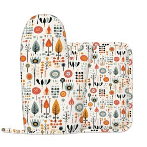 May include: An oven mitt and pot holder set with a cream background and a colorful floral pattern. The design includes orange, yellow, gray, and black stylized flowers and leaves. The mitt is approximately 13 inches long.