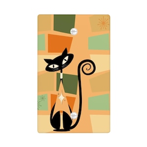 May include: A decorative light switch cover featuring a stylized black cat with a long, curled tail. The cat is set against a retro-style background of orange, green, and tan geometric shapes. Two small, round, white accents are included.
