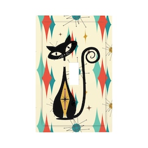 May include: A decorative light switch cover featuring a black cat design with a curled tail. The cat is set against a cream background with a retro pattern of teal, red, and gold diamonds and starbursts. The switch is white.