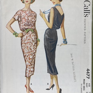 May include: Vintage McCall's printed sewing pattern, number 4477, featuring illustrations of two dresses. One dress is a white lace design with a green belt, and the other is a dark gray dress. The pattern includes size 12, with a bust measurement of 32 inches.