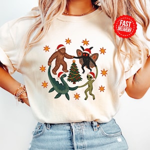 Christmas t-shirt with dancing cryptids, Bigfoot Alien Mothman Loch Ness Vintage T-shirt, bizarre Christmas gift, washed Weirdcore shirt