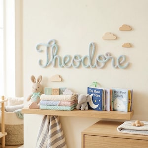 May include: A set of three ceramic mugs with a speckled, matte finish. Each mug features a different color: light blue, cream, and gray. The mugs have a simple, modern design and a comfortable handle.