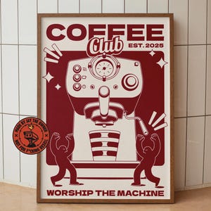 Può includere: Un poster incorniciato con un design rosso e crema. Il poster presenta un'illustrazione di una macchina da caffè con le parole "COFFEE Club EST. 2025" in alto e "WORSHIP THE MACHINE" in basso. Due figure sono raffigurate in silhouette.