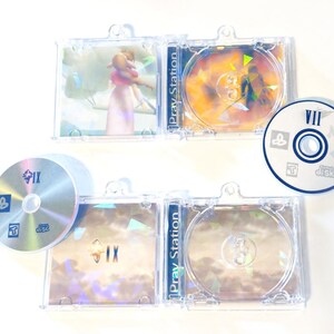 May include: A collection of PlayStation game discs and cases. The cases are clear plastic, and the discs have colorful graphics. The games appear to be Final Fantasy titles, with Roman numerals and the text "Pray Station" visible.