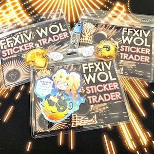 May include: A collection of Final Fantasy XIV (FFXIV) themed stickers and badge holders. The badge holders read "FFXIV WOL STICKER TRADER". Stickers include character art and the text "Glistuffed". The stickers are in clear plastic sleeves.