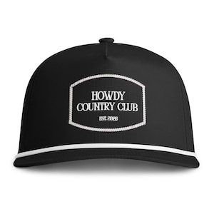 May include: A black baseball cap featuring a white rope trim along the base of the crown. Centered on the front is a white embroidered patch with a rope border containing the text HOWDY COUNTRY CLUB and the smaller text EST. 2026.
