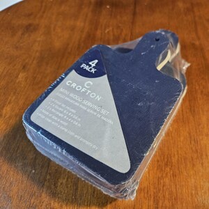 May include: A package of four mini wood serving sets from Crofton. The package is blue and white and says "4 Pack" and "Mini Wood Serving Set".