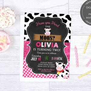 May include: A pink and black cow-themed birthday invitation for a girl turning two. The invitation features a black and white cow print background, a chalkboard with the text "Have you Herd the Moos? Olivia is turning two!" and a pink and white gingham pattern. The invitation also includes a cute cartoon cow.