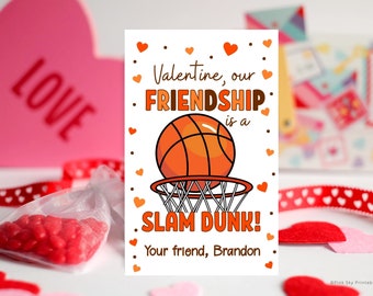 May include: Valentine's Day card with a basketball theme. The card features an orange basketball going into a net, with the text "Valentine, our FRIENDSHIP is a SLAM DUNK!" and "Your friend, Brandon."