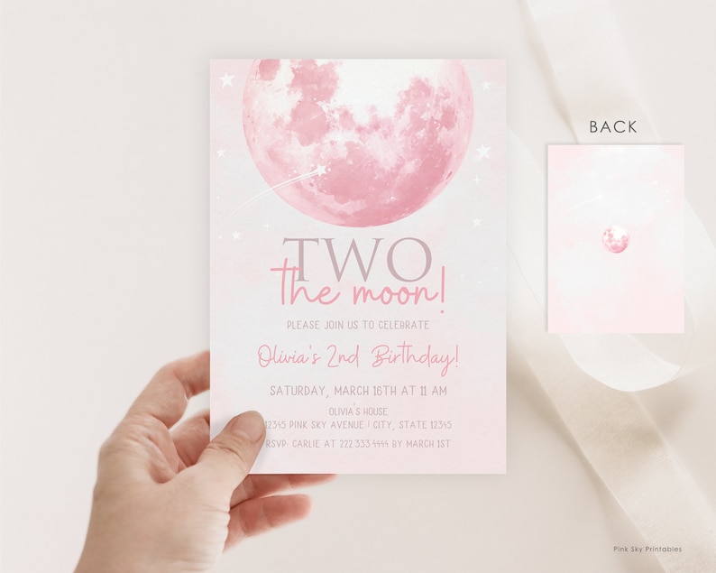 May include: Pink and gray invitation with a pink moon and stars. The text reads "TWO the moon! Please join us to celebrate Olivia's 2nd Birthday! Saturday, March 16th at 11 AM Olivia's House 12345 Pink Sky Avenue City, State 12345 RSVP Carlie at 222 333 1114 by March 1st"