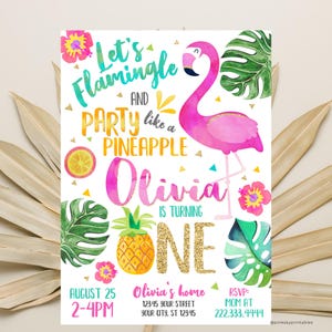 May include: A pink flamingo with a watercolor effect stands on one leg. The flamingo is surrounded by tropical leaves, a pineapple, and a bright yellow lemon. The text "Let's Flamingle and Party like a Pineapple" is written in a colorful font. The text "Olivia is turning One" is written in a pink and gold font. The date "August 25" and time "2-4PM" are written in black. The text "Olivia's home" is written in black. The address "12345 Your Street, Your City, ST 12345" is written in black. The text "RSVP: Mom at 222.333.4444" is written in black. The text "@pinkskyprintables" is written in black.