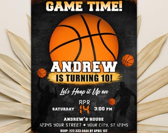 May include: A black and orange basketball birthday party invitation with a basketball graphic and the text "GAME TIME!" "ANDREW IS TURNING 10!" "Let's Hoop it Up on APR 14 3:00 PM" "ANDREW'S HOUSE 12345 YOUR STREET YOUR CITY, ST 12345 RSVP: 222.333.4444 BY APRIL 1ST"
