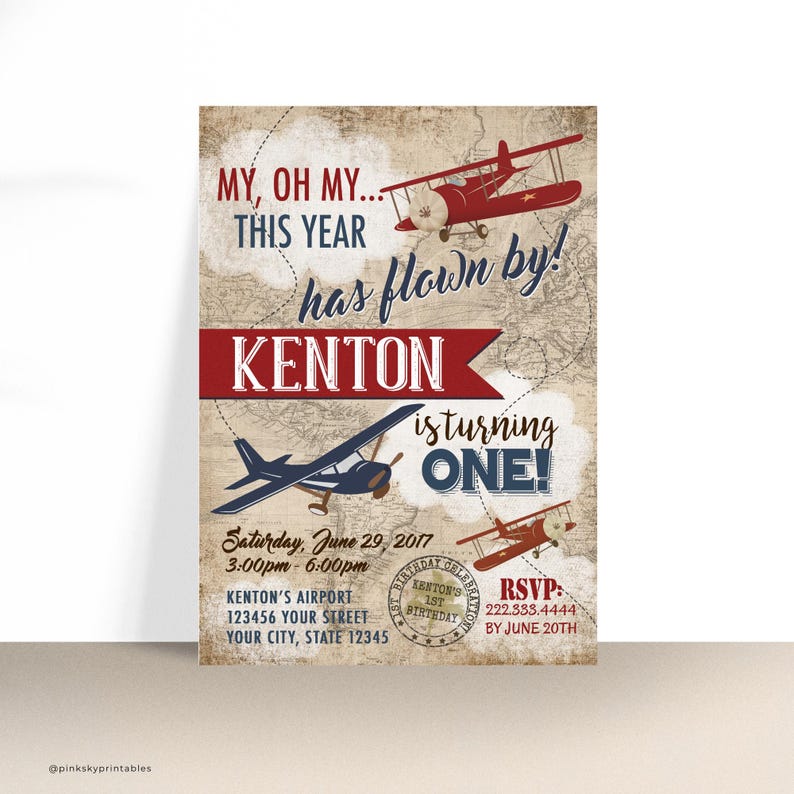 May include: A vintage-style airplane themed first birthday party invitation with a red, white, and blue color scheme. The invitation features a map background with airplanes and the text "MY, OH MY... THIS YEAR HAS FLOWN BY! KENTON IS TURNING ONE!"  The invitation also includes the date, time, and location of the party.