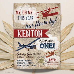 May include: A vintage-style airplane birthday invitation for a boy turning one year old. The invitation features a red and blue airplane with the text "My, oh my... This year has flown by! Kenton is turning one!" and a map background.
