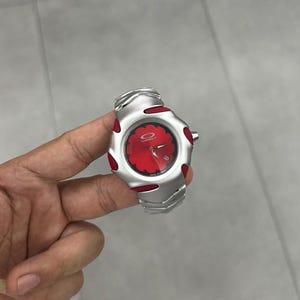 Oakley Timebomb Red Edition – Futuristic Stainless Steel Watch with Red Accents