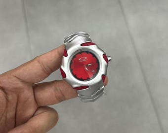 Oakley Timebomb Red Edition – Futuristic Stainless Steel Watch with Red Accents