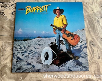 Jimmy Buffett – Lp vinyle Riddles In The Sand 1976 Disque NM- MCA Records – MCA-5512