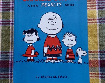 PEANUTS  Charlie Brown Snoopy We Are Right Behind You, Charlie Brown Softcover Book Charles Schultz 1964 1st Printing