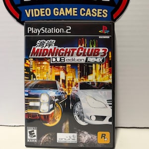 May include: A PlayStation 2 video game case for Midnight Club 3: DUB Edition Remix. The cover art features two cars in front of a city skyline. The game case is displayed in front of a Meteor Rock logo.