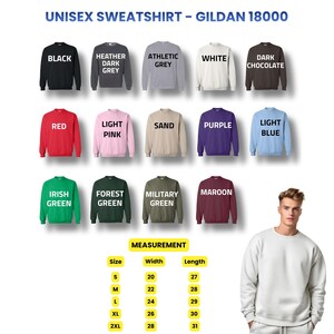 Op de afbeelding: Een display van Gildan 18000 unisex sweatshirts in diverse kleuren, waaronder zwart, rood en wit. De afbeelding bevat een maattabel met afmetingen in cm, vari&euml;rend van maat S tot 2XL, met breedtes en lengtes.