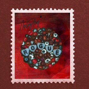 May include: A decorative stamp with a red background and a cluster of colorful beads. The word "ROGUE" is spelled out with heart-shaped letter beads. The stamp has a white border with a perforated edge.