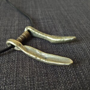 Celtic woad grinder pendant necklace hand cast bronze tribal