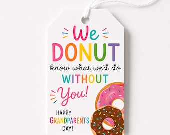 May include: A white rectangular gift tag with a white string at the top. The text reads We DONUT know what we'd do WITHOUT You! HAPPY GRANDPARENTS DAY! in colorful letters. Two illustrated donuts with pink and chocolate frosting are at the bottom.