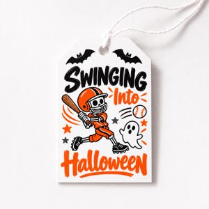 May include: A white rectangular gift tag with a string, featuring a skeleton wearing an orange baseball uniform and helmet, swinging a bat at a baseball. The text reads SWINGING Into Halloween, accompanied by black bats, stars, and a white ghost.
