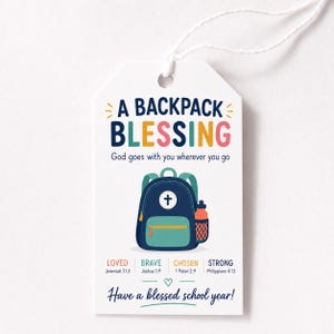 May include: A white rectangular gift tag with a string, featuring the text A BACKPACK BLESSING, God goes with you wherever you go, and Have a blessed school year. It displays a navy and teal backpack illustration and the words LOVED, BRAVE, CHOSEN, STRONG.