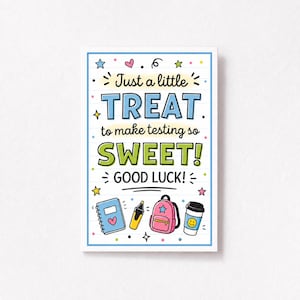 May include: A rectangular card with a white background and blue border featuring the text "Just a little TREAT to make testing so SWEET! GOOD LUCK!" surrounded by colorful illustrations of a notebook, highlighter, backpack, and coffee cup.