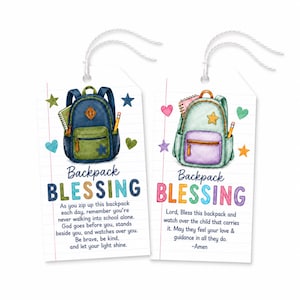 May include: Two rectangular white gift tags with white string loops. The left tag features a blue and green backpack illustration with the text 'Backpack BLESSING' and a prayer. The right tag shows a mint and purple backpack with 'Backpack BLESSING' and a prayer.