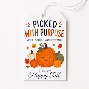May include: A white rectangular gift tag with a string, featuring the text PICKED WITH PURPOSE, Loved, Chosen, Wonderfully Made, 1 Peter 2:9, and Happy Fall. The design includes a central orange pumpkin with a face surrounded by smaller pumpkins.