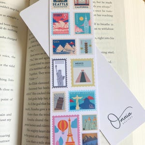 May include: A bookmark with colourful postage stamp designs of global landmarks, such as the Eiffel Tower and the Sydney Opera House. The bookmark is labelled "Landmarks" and "Front & Back."