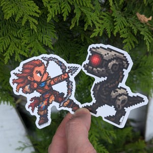 Horizonstickers | Zero Dawn Forbidden West geïnspireerde Pixel Watcher & Aloy-vinyl matte sticker | Retro videogameontwerpen | Uniek gamercadeau