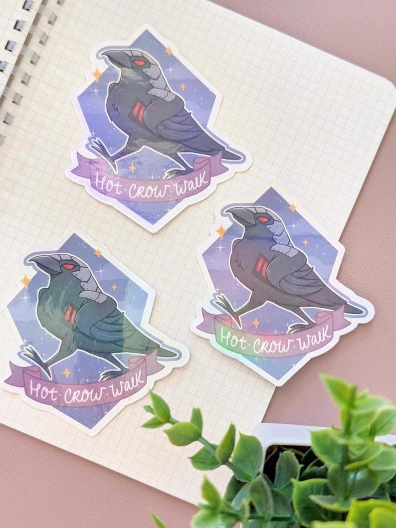 May include: Three stickers featuring a stylized crow with red eyes and a futuristic design. The crow is set against a diamond-shaped background with a purple and blue gradient. The text "Hot Crow Walk" is on a banner.