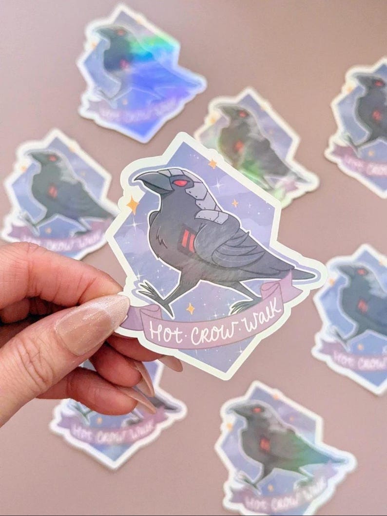 May include: A collection of stickers featuring a stylized crow with red eyes and metallic accents. The crow is set against a purple and blue diamond-shaped background with the text "Hot Crow Walk" on a banner.