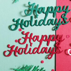 May include: A festive holiday-themed design with the words "Happy Holidays" in black, green, and red script. The design includes green sprigs and red circular accents on a light green and red background.