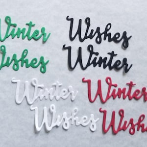 May include: Assortment of die-cut words in various colors: green, black, white, and red. The words "Winter" and "Wishes" are displayed in a cursive font. Ideal for holiday crafts and decorations.