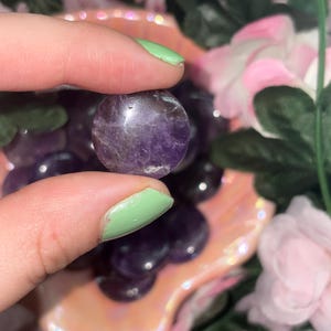 May include: A distressed wooden sign with the words "Welcome to our home" in white. The sign has a rustic finish and a simple design, ideal for a hallway or porch.