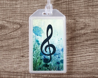 Etiqueta de equipaje con identificación para estuche de instrumento musical con clave de sol y diseño floral azul
