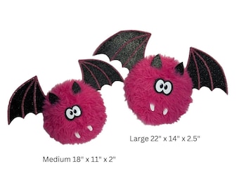 Fuzzy pink bat wreath attachment with sparkling black wings, whimsical handcrafted Halloween bat wall decor, pink festive Halloween bat