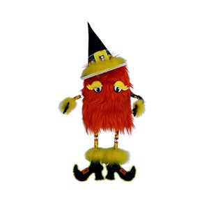 May include: A red and yellow Halloween witch doll with a black witch hat and black shoes. The doll has a fuzzy orange body and yellow eyes.