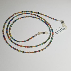 May include: Multicolored beaded eyeglass holder with silver metal clasps. The holder is 30 inches long and has a tag that reads "RockMyBeads 30" Eyeglass Holder".