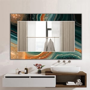 May include: A rectangular wall mirror featuring a decorative border with a swirling agate pattern in shades of deep emerald green, dark teal, and warm amber gold. The reflective surface shows a view of a room with curtains and clothing.