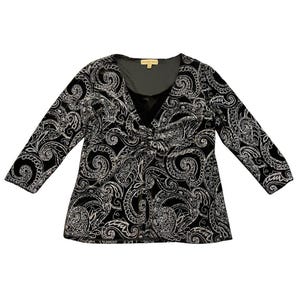 May include: Black and white paisley print top with a V-neckline and three-quarter sleeves. The top has a gathered detail at the bust and a dark gray lining. The fabric has a velvet-like texture.