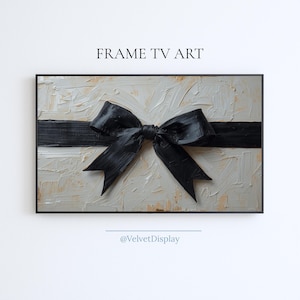 Könnte beinhalten: Gerahmtes Kunstwerk mit strukturiertem Hintergrund in Beige- und Cremetönen. Ein schwarzes Band ist in der Mitte zu einer Schleife gebunden. Der Text "FRAME TV ART" steht oben und "@VelvetDisplay" unten.