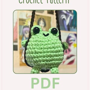 May include: A crochet pattern for a green frog with black eyes. The pattern is available as a PDF download and is described as "Low in sew".