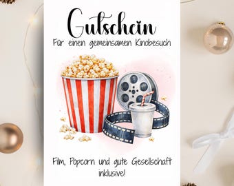 May include: A gift certificate with a watercolor illustration of a popcorn bucket, film reel, and drink. The text reads "Gutschein" and "Film, Popcorn und gute Gesellschaft inklusive!" in German. The bottom text says "Das perfekte Last-Minute-Geschenk."
