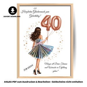 以下が含まれることがあります： バラ色のゴールドの数字40の風船を持った女性が描かれた額入りのプリント。女性は紙幣で作られたドレスを着ています。「Herzlichen Glückwunsch zum Geburtstag!」と「Für Dich!!」というテキストがあります。